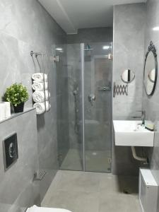 a bathroom with a shower and a sink at The boutique in Jerusalem