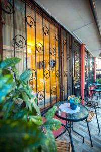 a balcony with a table and a wrought iron fence at Apartments Beautiful Tbilisi on L.Meskhishvili Turn 1 in Tbilisi City