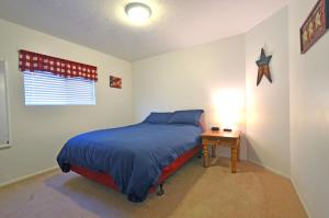 A bed or beds in a room at Top of the Town Vacation Home Rental