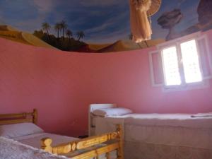 
A bed or beds in a room at Safari Camp Bahariya Oasis
