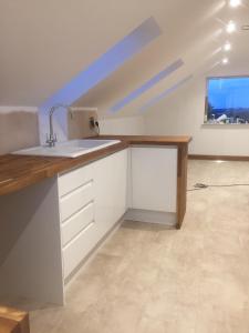 a kitchen with a sink and a counter top at quiet secluded loft in County Durham in Durham