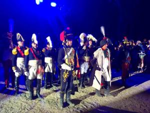 a group of men in uniform standing in a parade at 1 Trova-Ranocchietto in Tucce