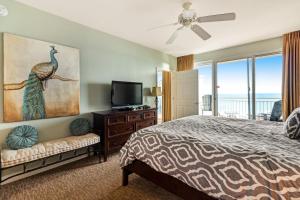 a bedroom with a bed and a flat screen tv at Sterling Shores 807 Destin (Condo) in Destin