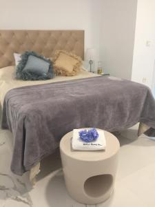 Málaga Beauty Home tesisinde bir odada yatak veya yataklar