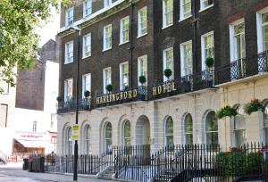 a building with a sign for the harvard hotel at Harlingford Hotel in London