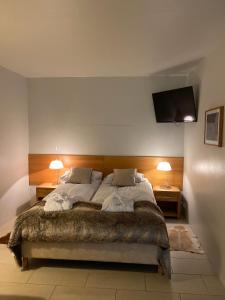 Posteľ alebo postele v izbe v ubytovaní Hotel Laki