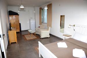 a living room with a couch and a table at Студия Давидов "Studios Davidoff"- апартаменти под наем in Plovdiv