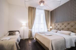 Posteľ alebo postele v izbe v ubytovaní Luxury Modern Designed Oldtown Apartment