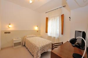 Postel nebo postele na pokoji v ubytování Hotel San Sebastiano