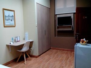 TV a/nebo společenská místnost v ubytování Hotel Inka Path