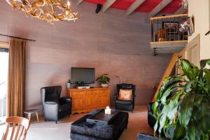 TV a/nebo společenská místnost v ubytování Bed&Bbq Longhornranch