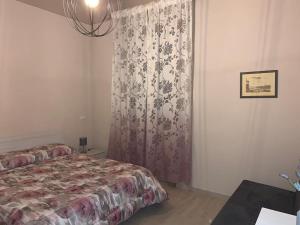 A bed or beds in a room at AL GELSOMINO