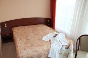 Postel nebo postele na pokoji v ubytování Hotel Balneolum Superior