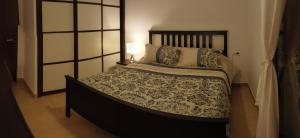 A bed or beds in a room at El Mocan Luxury Apartment