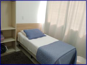 Postel nebo postele na pokoji v ubytování Hotel Anjos LTDA