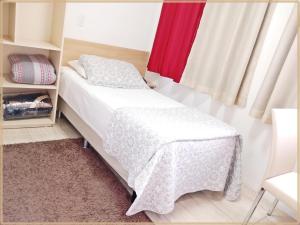 Postel nebo postele na pokoji v ubytování Hotel Anjos LTDA