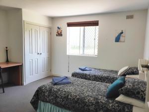 
A bed or beds in a room at Balcatta Sanctuary
