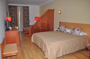 Postel nebo postele na pokoji v ubytování Across Hotels & Spa