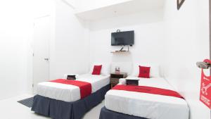 Letto o letti in una camera di RedDoorz near Liceo De Cagayan University Highschool
