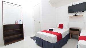 Letto o letti in una camera di RedDoorz near Liceo De Cagayan University Highschool