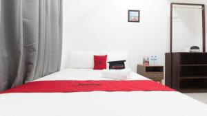 Letto o letti in una camera di RedDoorz near Liceo De Cagayan University Highschool