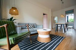 a living room with a couch and a table at IKO homes in Kota Kinabalu