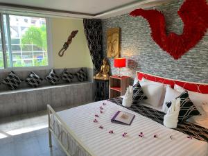 Letto o letti in una camera di Fong Kaew and Baan Nang Fa Guesthouse