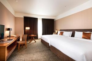 Letto o letti in una camera di Silks Place Yilan
