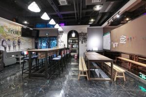 Lounge nebo bar v ubytování Zou Qu Ye Travel Hotel