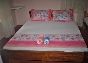 Postel nebo postele na pokoji v ubytování Deniyaya Guest House
