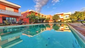 a swimming pool in front of a house at Agroktima Fourki in Aigio