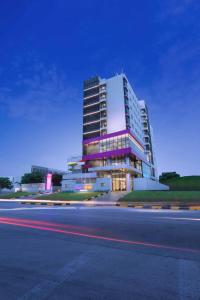 a large building on the side of a road at Quest Prime Cikarang by ASTON in Bekasi