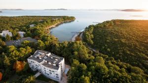 an aerial view of a building next to a river at Crvena Luka Resort in Biograd na Moru