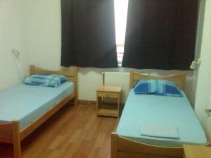 Llit o llits en una habitació de Hostel AV Palanka