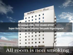 a building with a sign that reads all room is non smoking at Super Hotel Premier Saitama Higashiguchi in Saitama