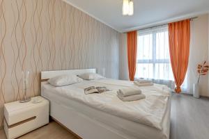 Posteľ alebo postele v izbe v ubytovaní GRANO FLATS Gdańsk - Aura I