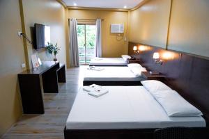 Posteľ alebo postele v izbe v ubytovaní The Mang-Yan Grand Hotel powered by Cocotel