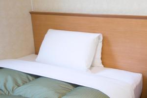 En eller flere senger på et rom på Best Inn Uozu