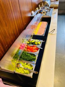 a buffet line with many different types of vegetables at Alva Donna Hotel in Kotelniki