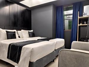 Llit o llits en una habitació de Loop On Leith George Town Penang Hotel