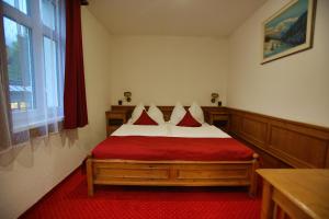 Postel nebo postele na pokoji v ubytování Hotel Jelinek