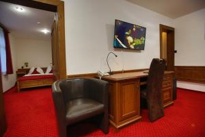 TV a/nebo společenská místnost v ubytování Hotel Jelinek