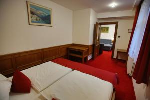Postel nebo postele na pokoji v ubytování Hotel Jelinek