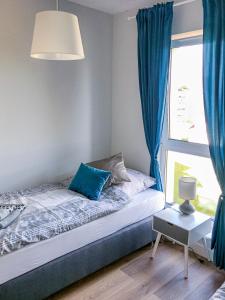 Posteľ alebo postele v izbe v ubytovaní Apartament Słoneczna 7