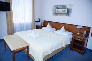Postel nebo postele na pokoji v ubytování Hotel Baden