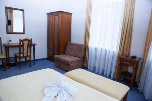 Postel nebo postele na pokoji v ubytování Hotel Baden