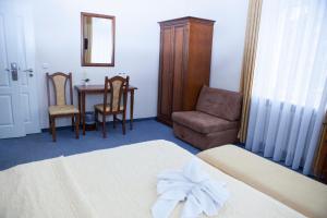 Postel nebo postele na pokoji v ubytování Hotel Baden