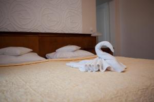 Postel nebo postele na pokoji v ubytování Hotel Baden