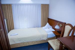 Postel nebo postele na pokoji v ubytování Hotel Baden