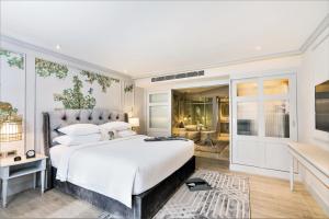 מיטה או מיטות בחדר ב-The Salil Hotel Sukhumvit 57 - Thonglor